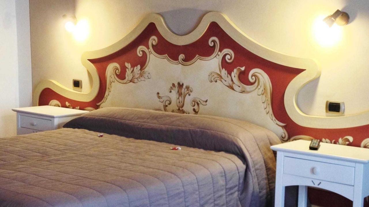 The painted headboard in the triple room